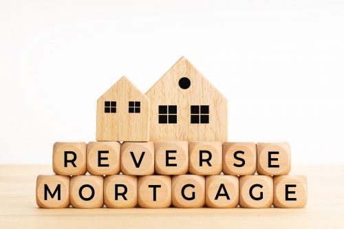 Reverse mortgage concept. Words on wooden blocks on table. Copy space